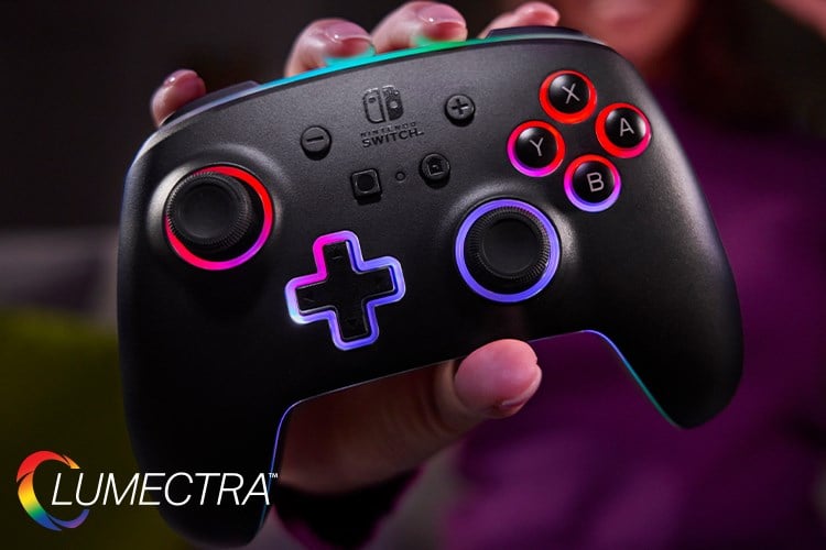 A hand gripping a glowing Lumectra controller holding it up to the camera