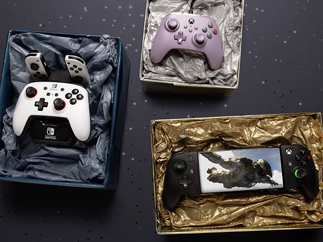 PowerA Controllers in gift boxes on a glittery holiday background