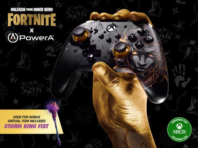 A golden hand holds the Midas controller on a black background