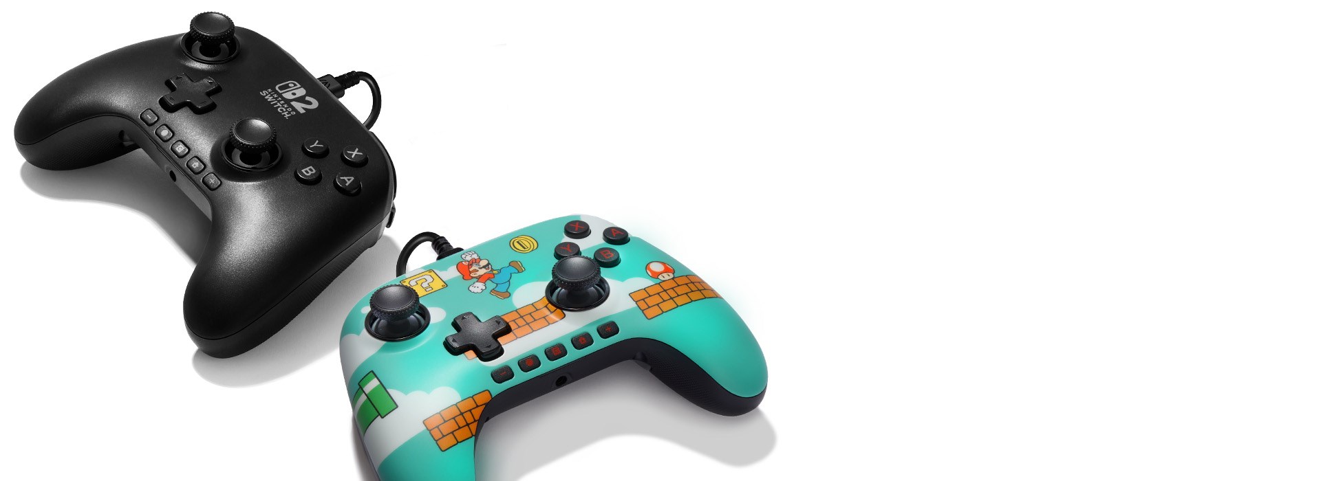 Nintendo Switch 2 controllers laying on a white ground