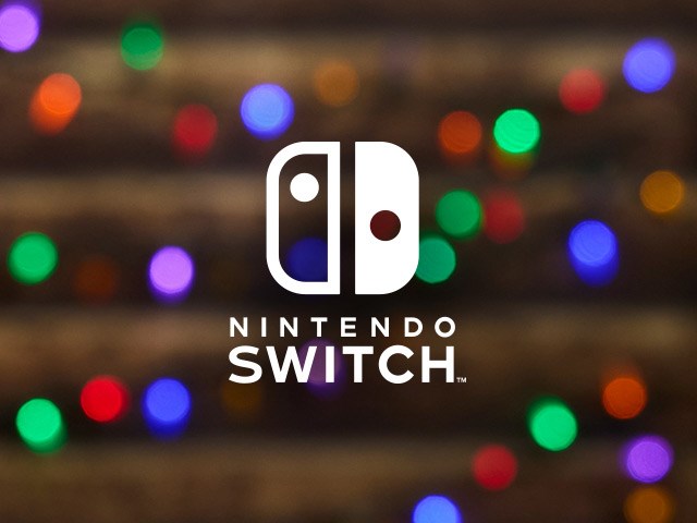 Nintendo Switch logo on a background of warm glowy holiday lights